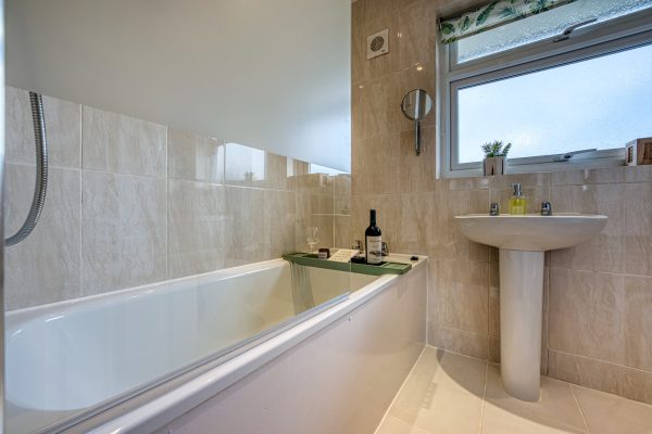 Bathroom with shower over the bath